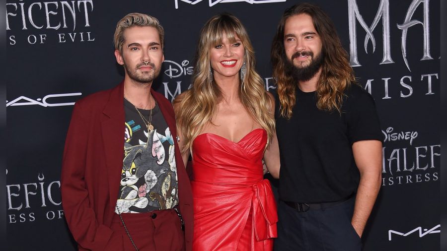 Bill Kaulitz (li.) zusammen mit Heidi Klum und deren Ehemann Tom Kaulitz. (amw/spot)