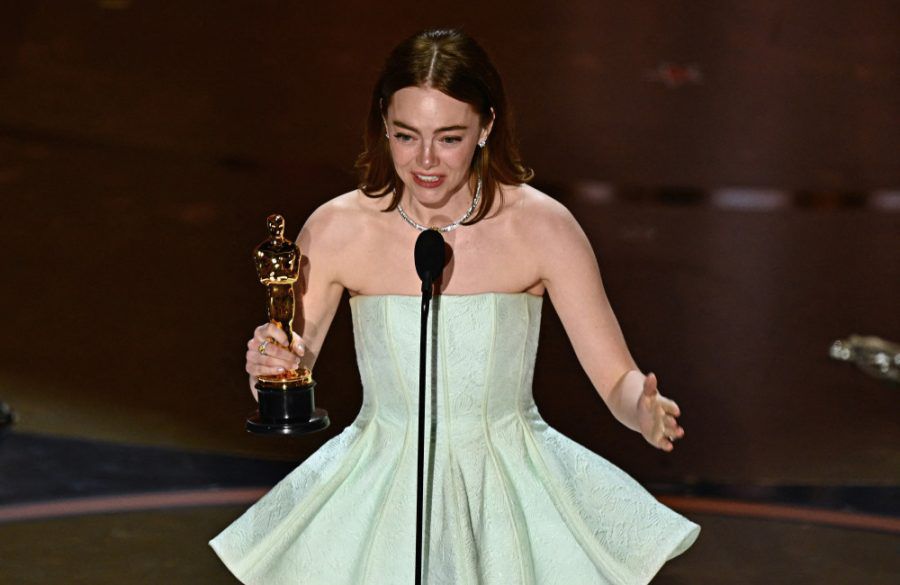 Emma Stone accepts the award for Best Actress in a Leading Role 96th Oscars - Getty BangShowbiz