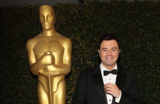 Seth MacFarlane - FEB 12 - Standing by giant Oscar BangShowbiz